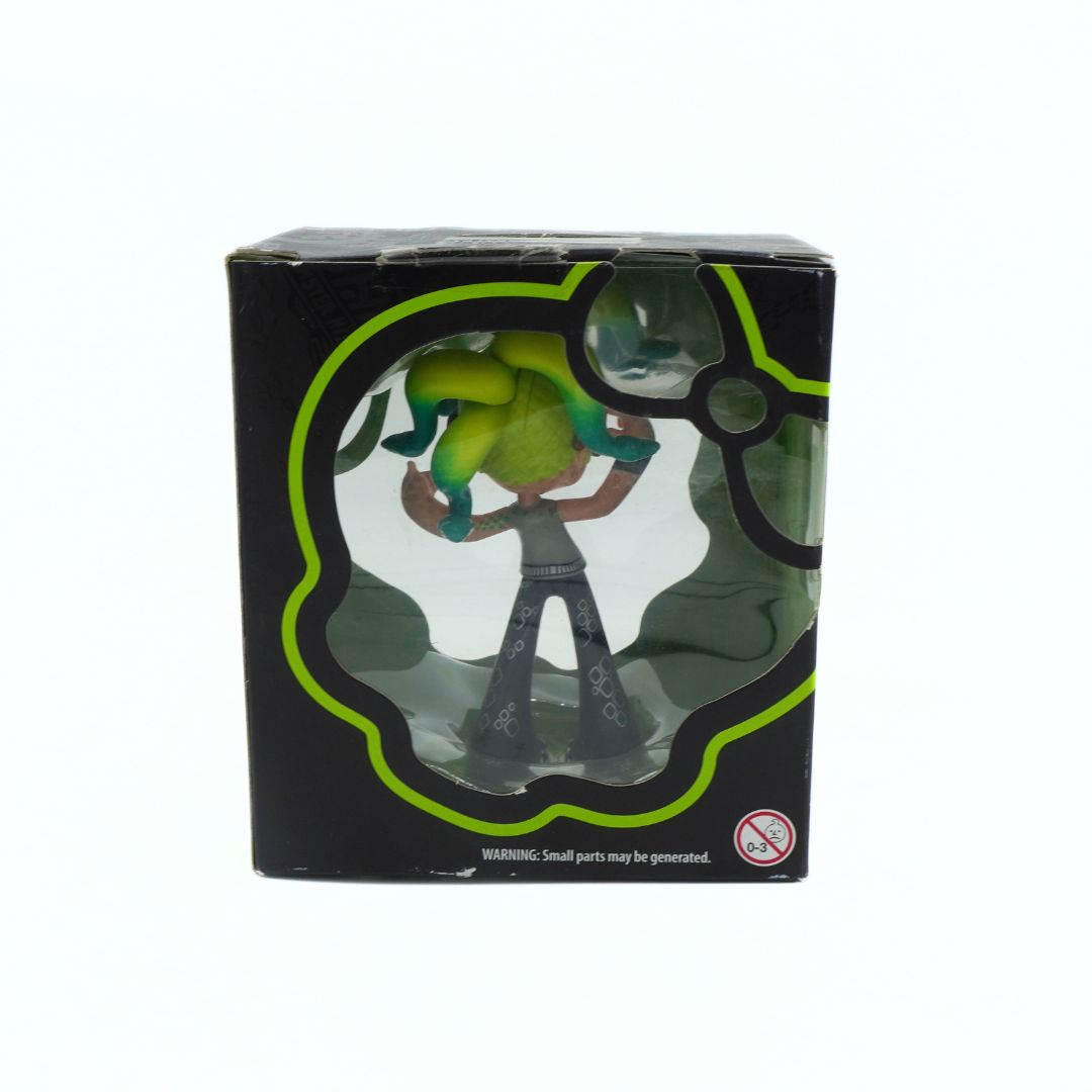 Toy figure in a transparent box with green accents on a white background