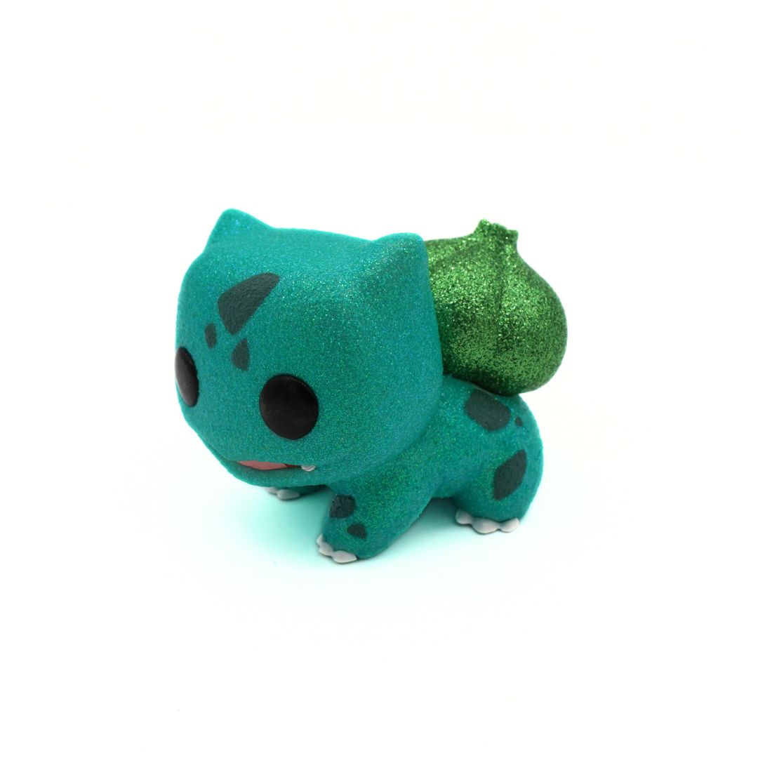 Teal toy with a green shell on a white background