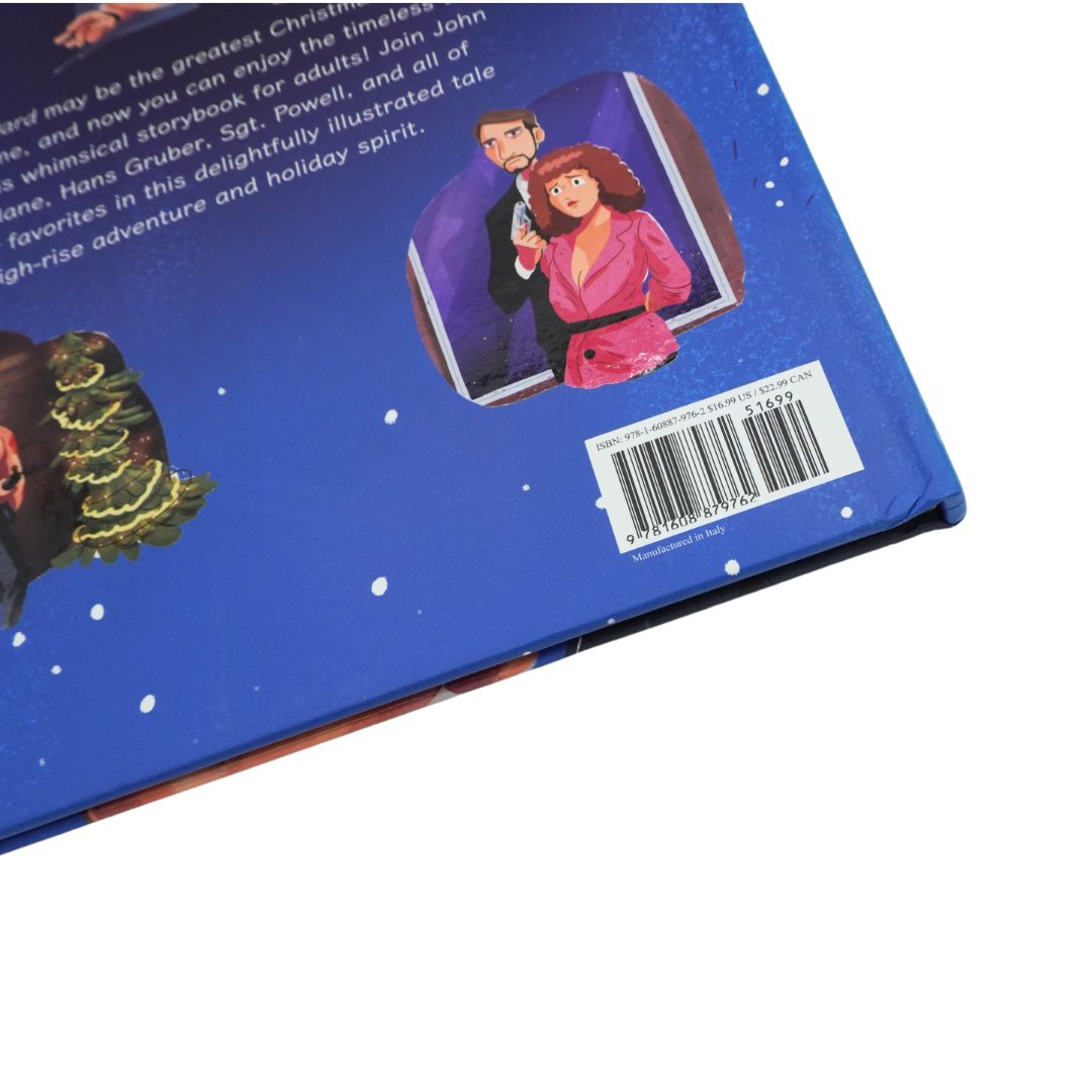 Front cover of the illustrated Die Hard book with a blue backdrop, showing the main characters. It is photographed on a white background
