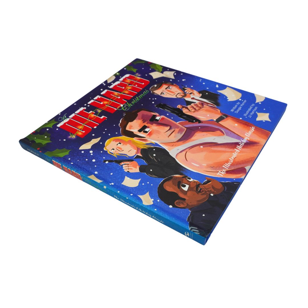 Front cover of the illustrated Die Hard book with a blue backdrop, showing the main characters. It is photographed on a white background