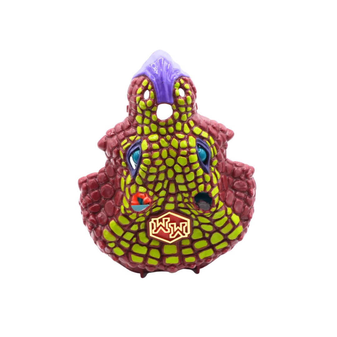 A red, green and purple Triceratops Mighty Max playset, photographed against a white background