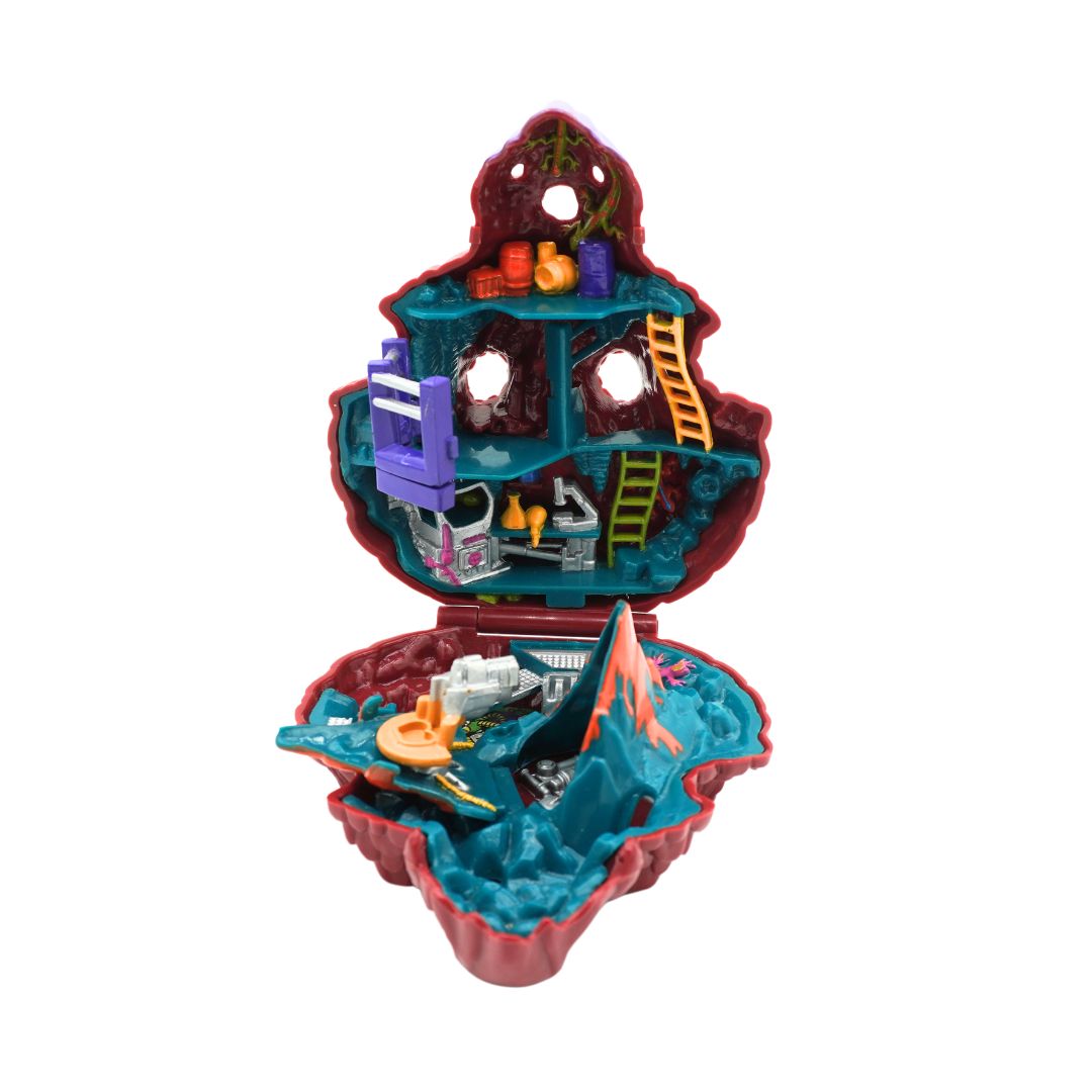 A red, green and purple Triceratops Mighty Max playset, photographed against a white background