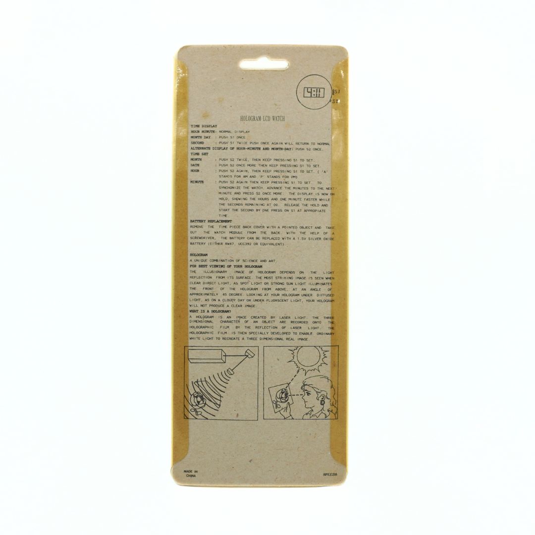 A vintage instruction card for a hologram watch, printed on a tan kraft paper backing card with a die-cut hanging slot at the top.