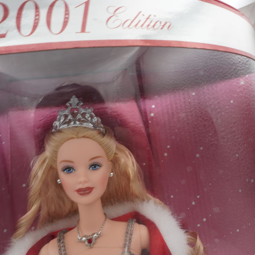 Barbie doll with tiara and fur collar in packaging labeled '2001 Edition'.