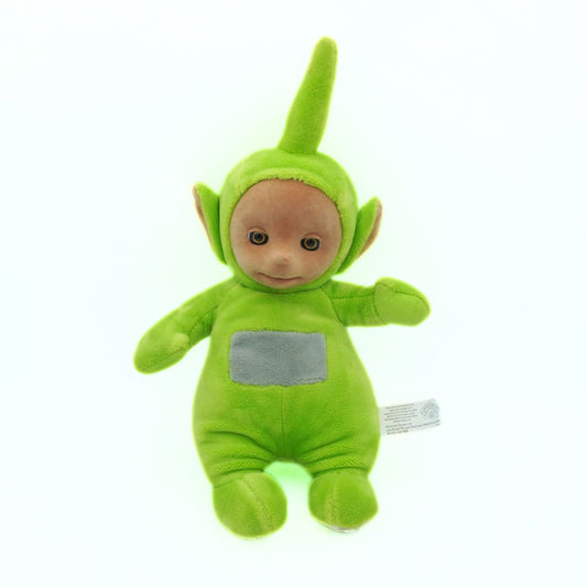 Green plush Teletubbies toy with pointed hat on a white background