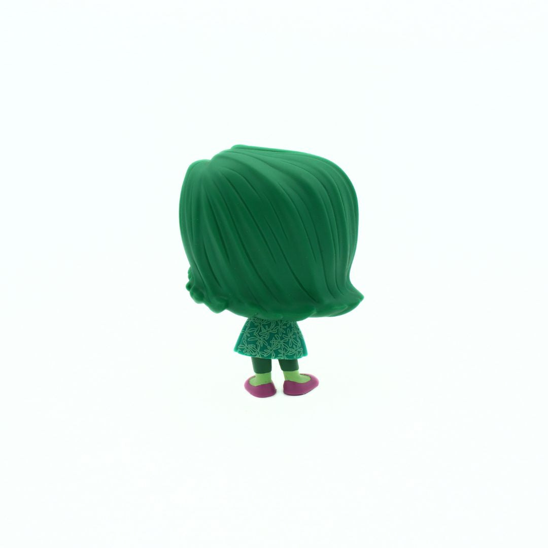 Green toy figure with a white background