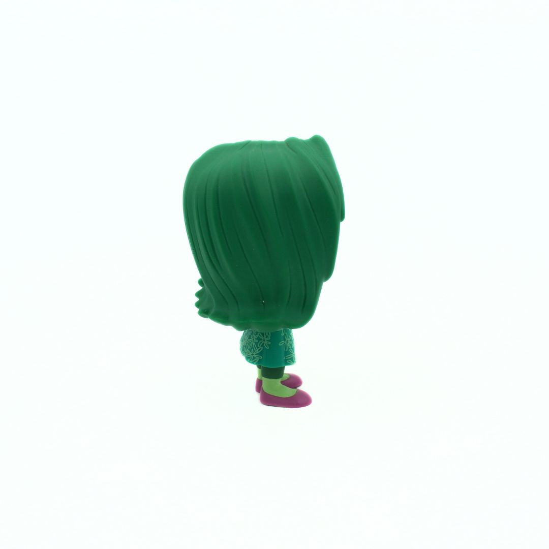 Green character figurine on a white background