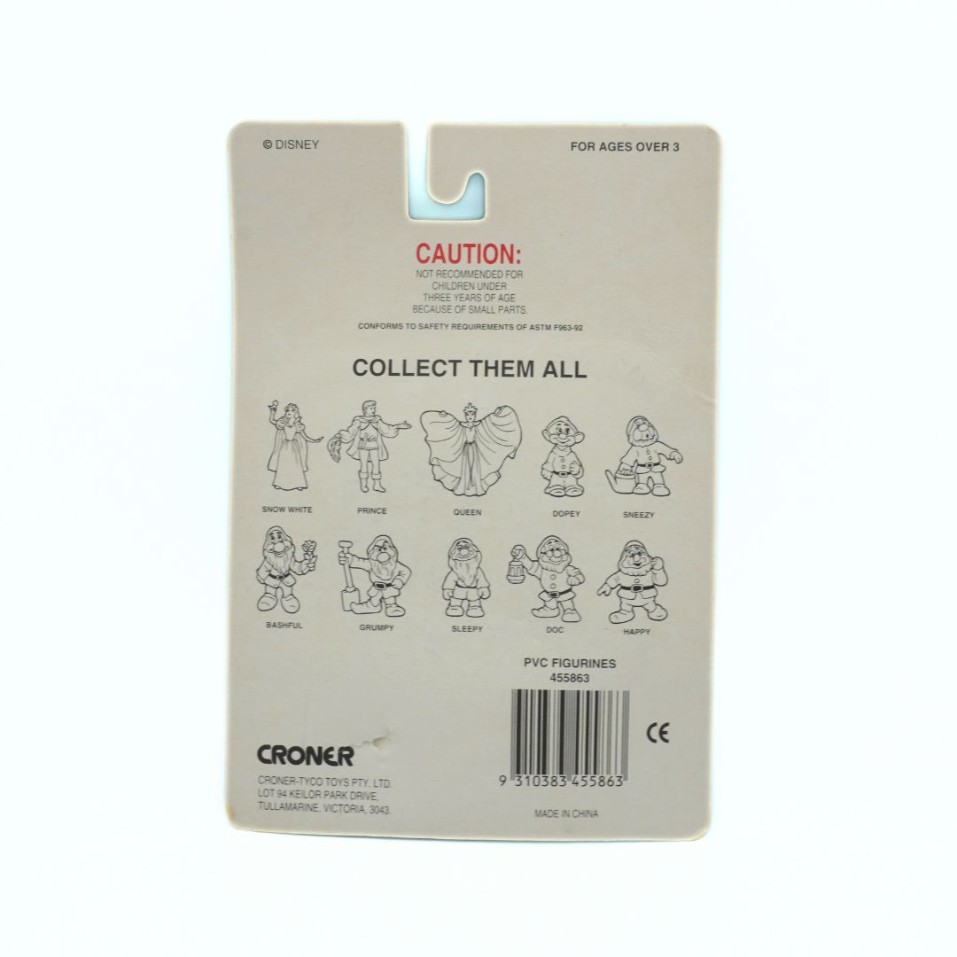 Back of a toy packaging with character illustrations and branding on a beige background