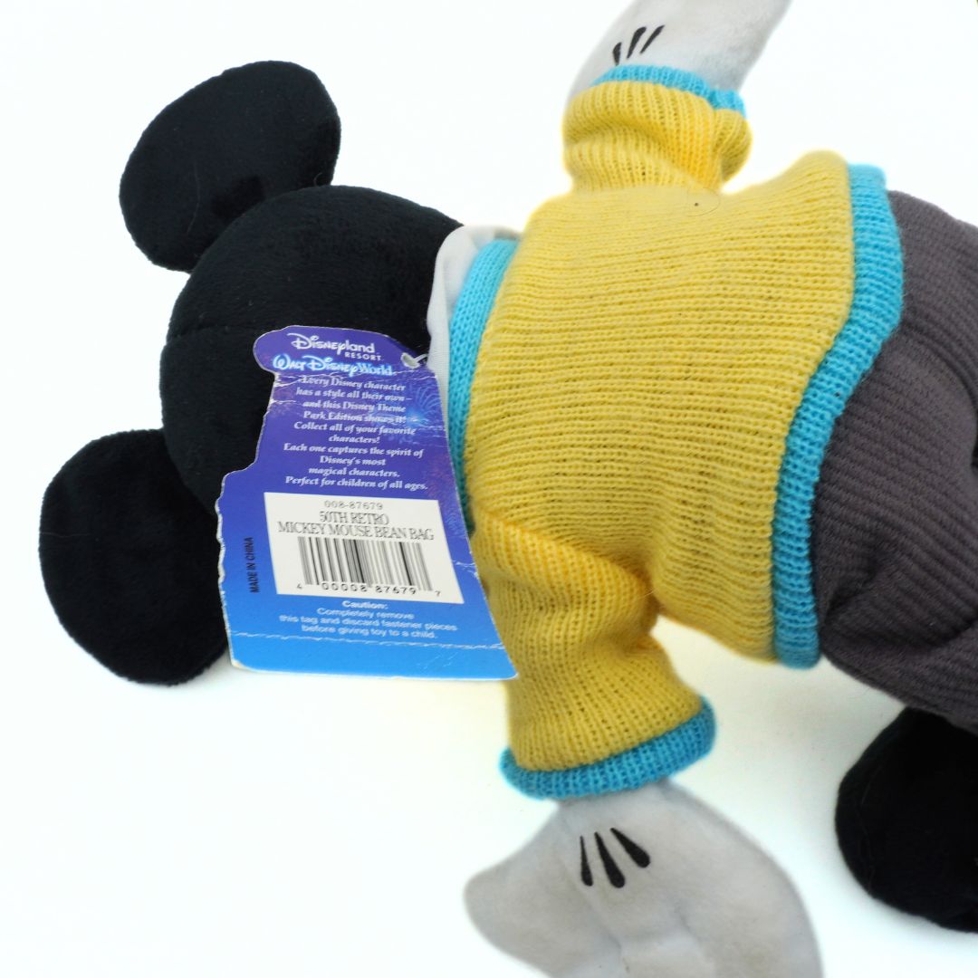 Plush toy with a tag showing Disney branding on a white background