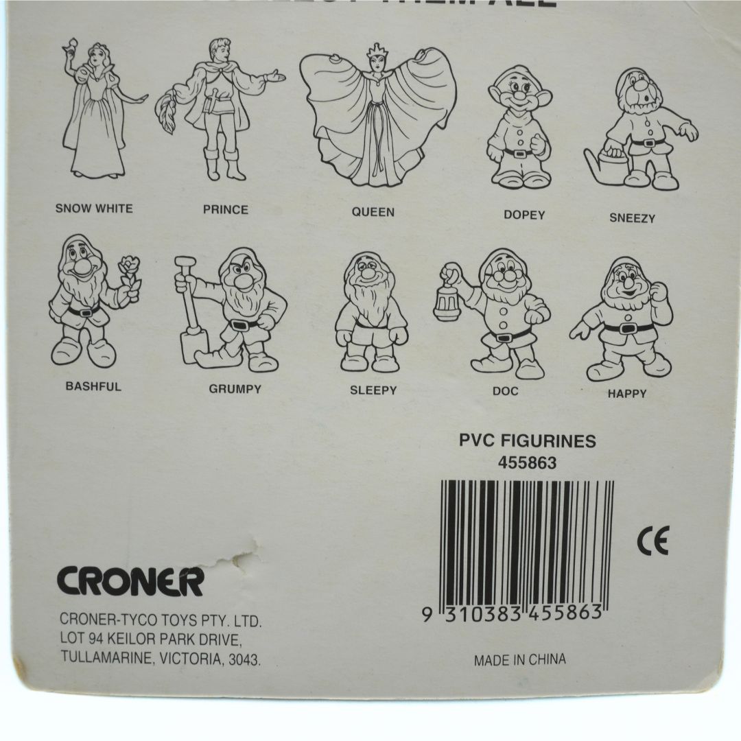 Back of a box with illustrations of Snow White and the Seven Dwarfs PVC figurines and branding details.