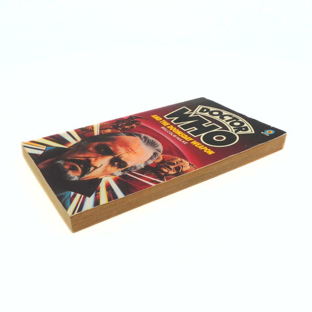 Book titled 'Doctor Who' with a cover featuring a character's face on a white background