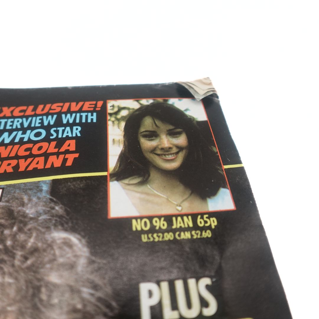 Top corner of the 96th issue of Doctor Who Magazine showing some creasing and a photo of Nicola Bryant
