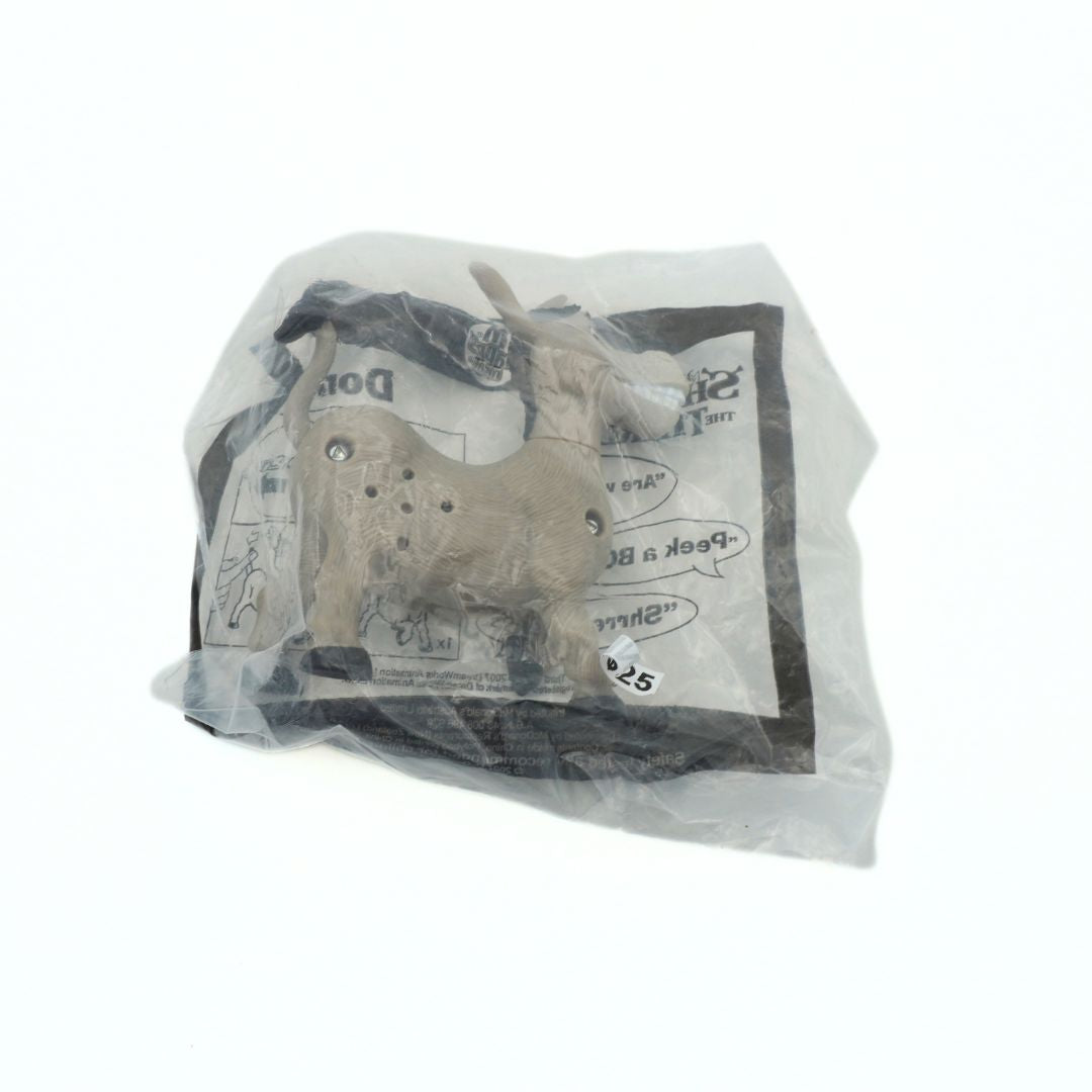 Plastic-wrapped toy donkey with packaging on a white background