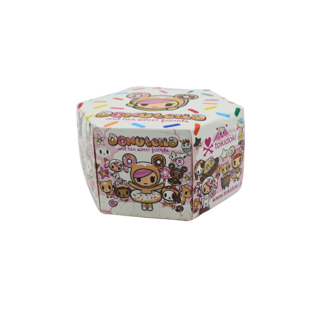 Donut themed hexagonal box for Donutella and her Sweet Friends by Tokidoki, photographed on a white background