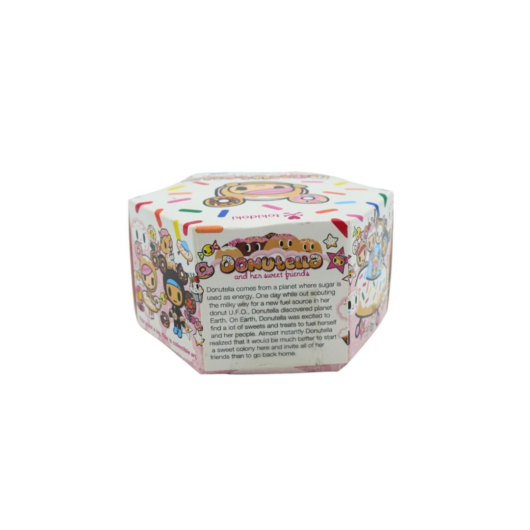 Donut themed hexagonal box for Donutella and her Sweet Friends by Tokidoki, photographed on a white background