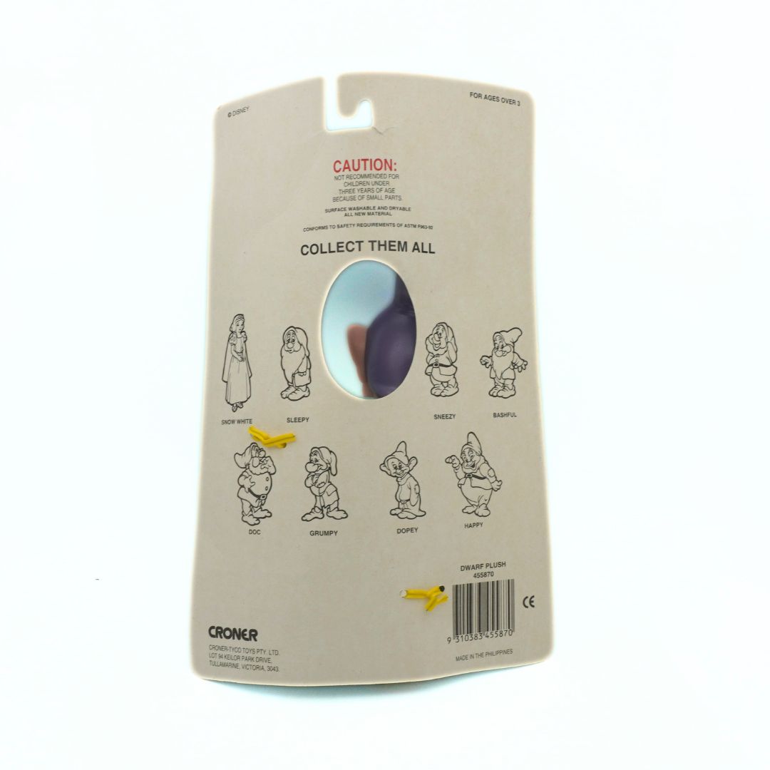 Back of a toy packaging with character illustrations and 'Collect Them All' text on a beige background