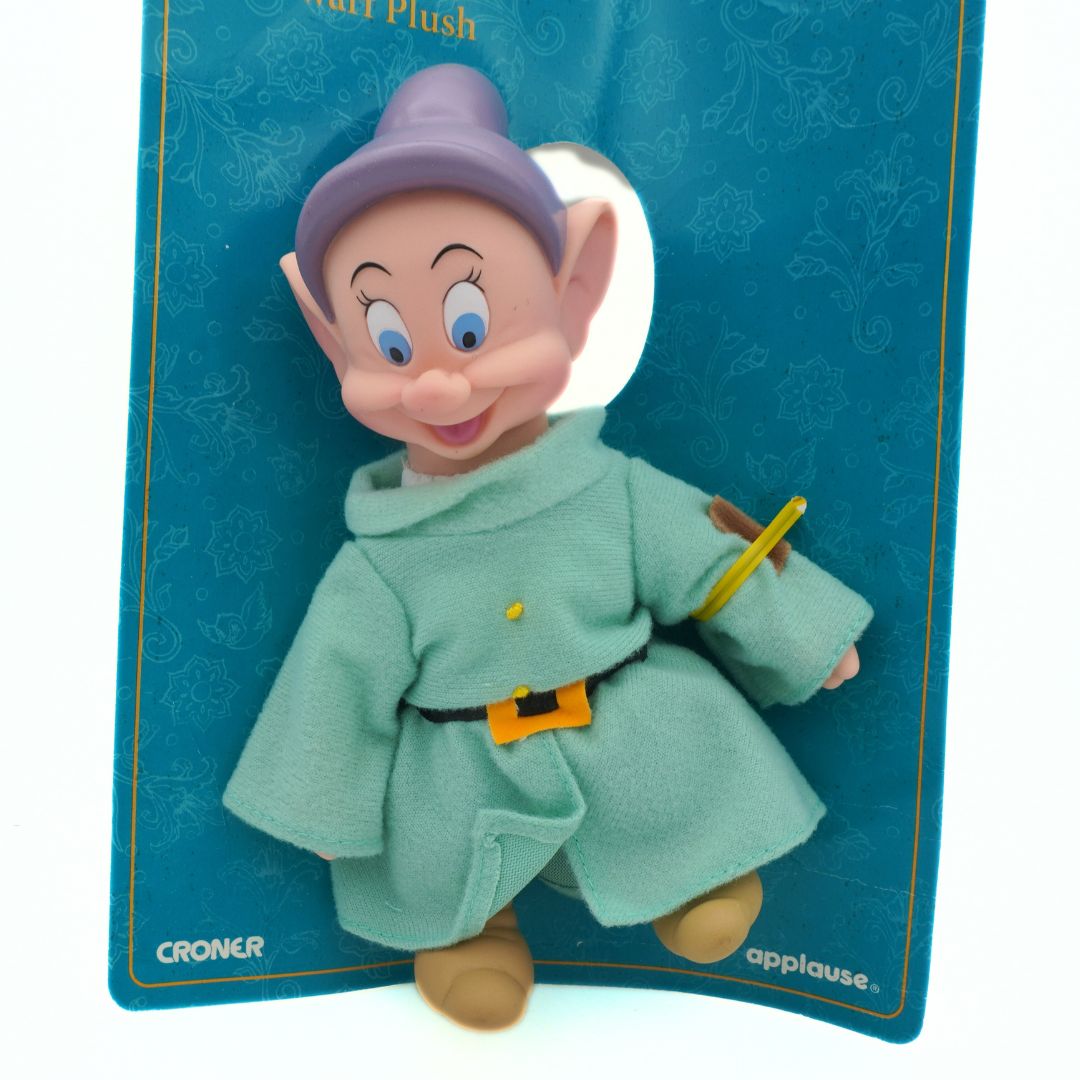 Plush toy of a character from Disney on a blue card with 'Croner' branding.