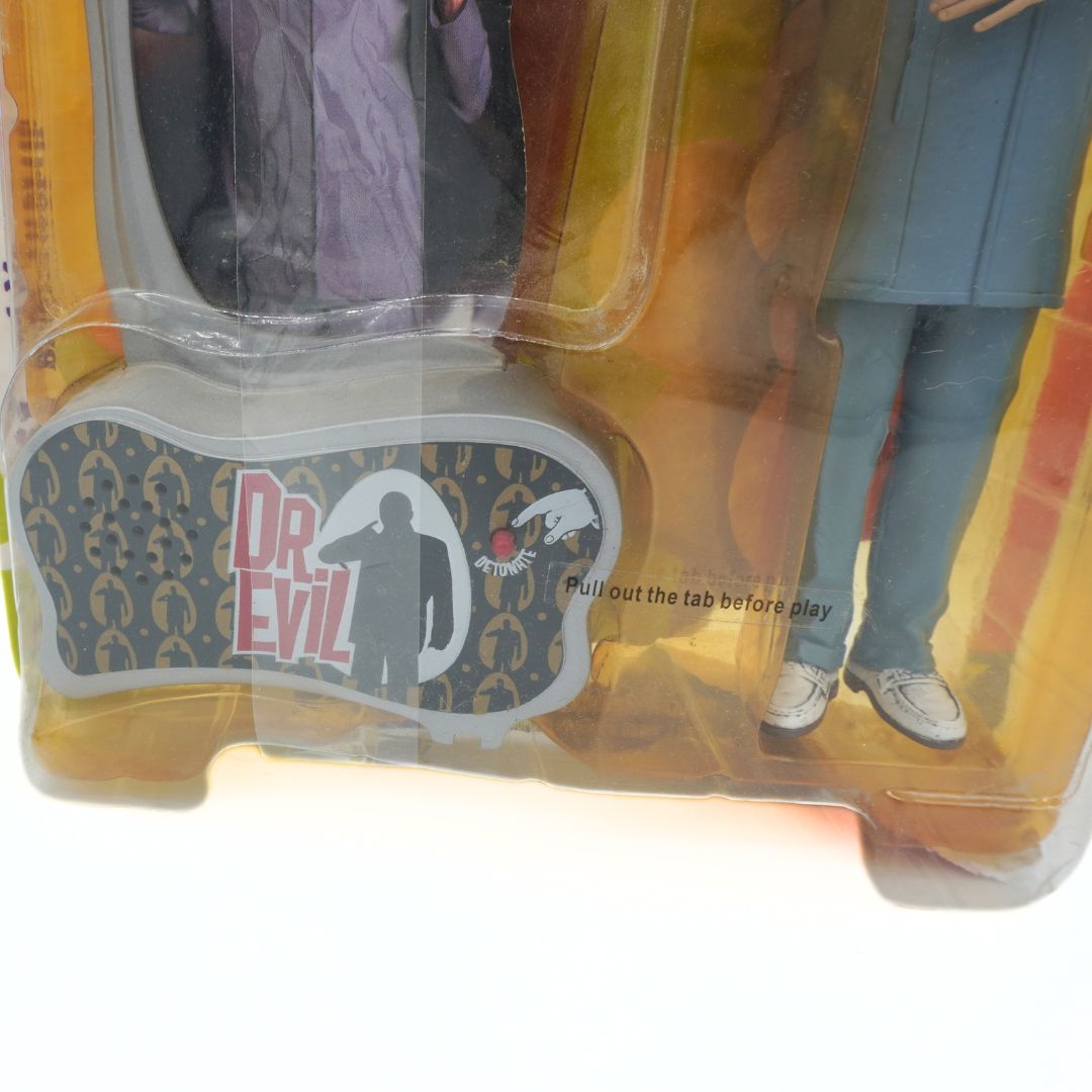 Toy figure in packaging with 'Dr. Evil' branding
