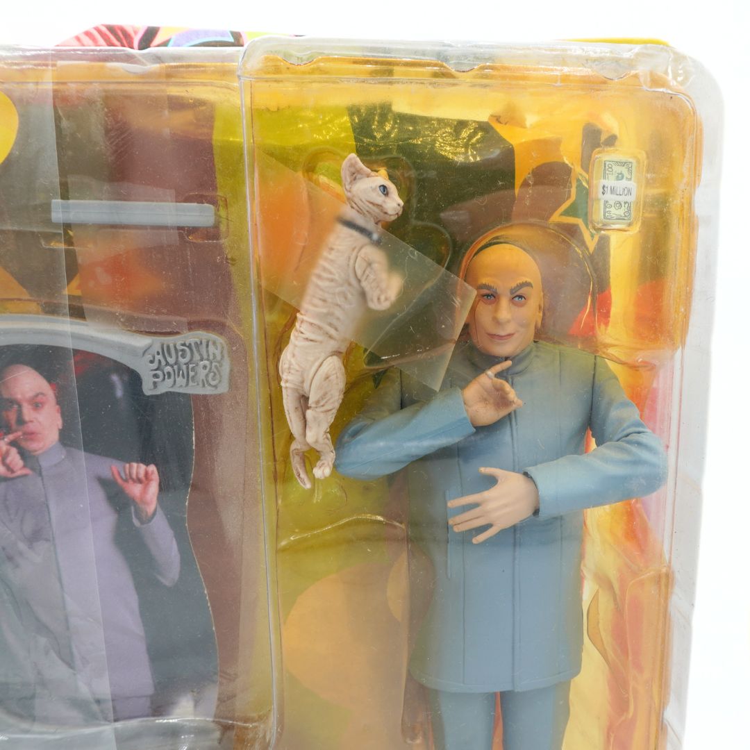 Action figure of a character from 'Austin Powers' with a cat, still in packaging.