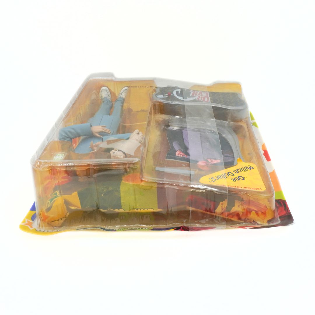 Toy figure set in clear packaging on a white background
