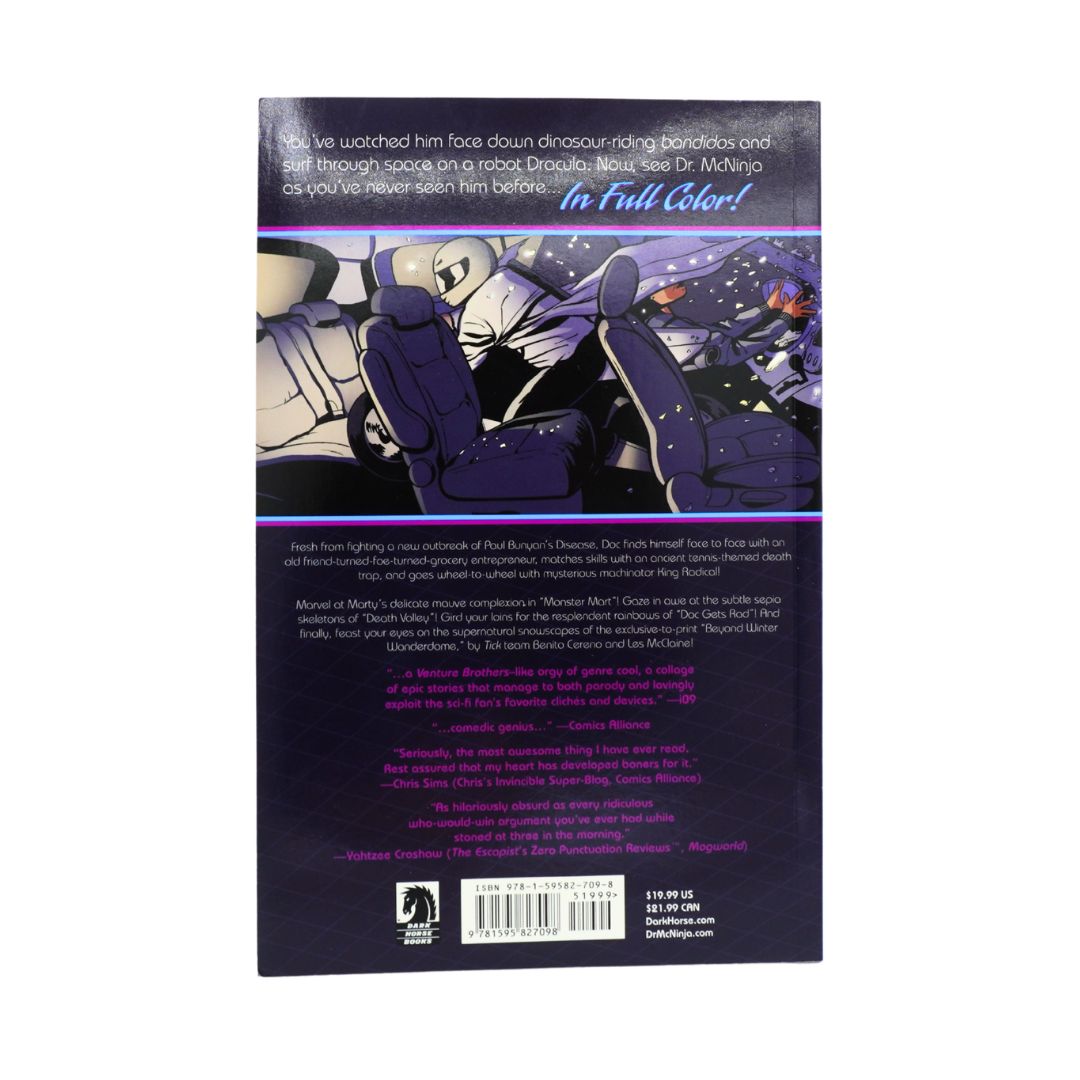 The back cover of a book, shown against a plain white background. The cover features a dark purple and black design with a central illustration of a character in a space-themed vehicle, along with text and a barcode at the bottom.