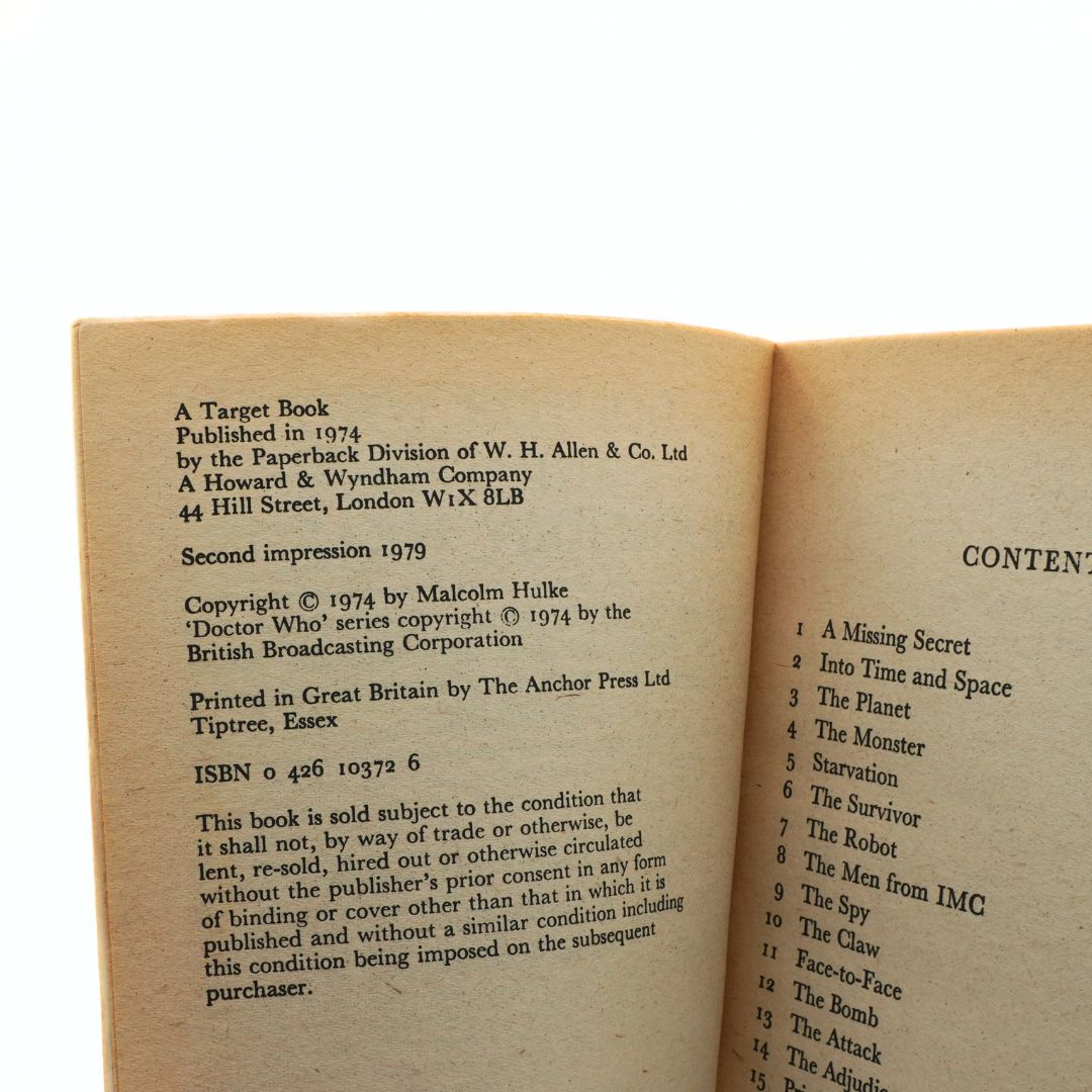 Open book showing copyright and content pages on a white background