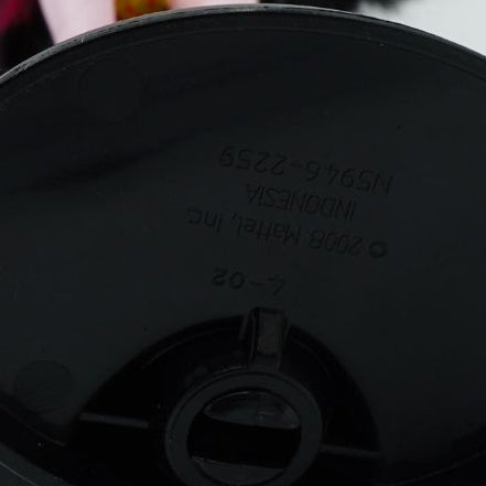 Underside of a G1 Draculaura black stand with branded details