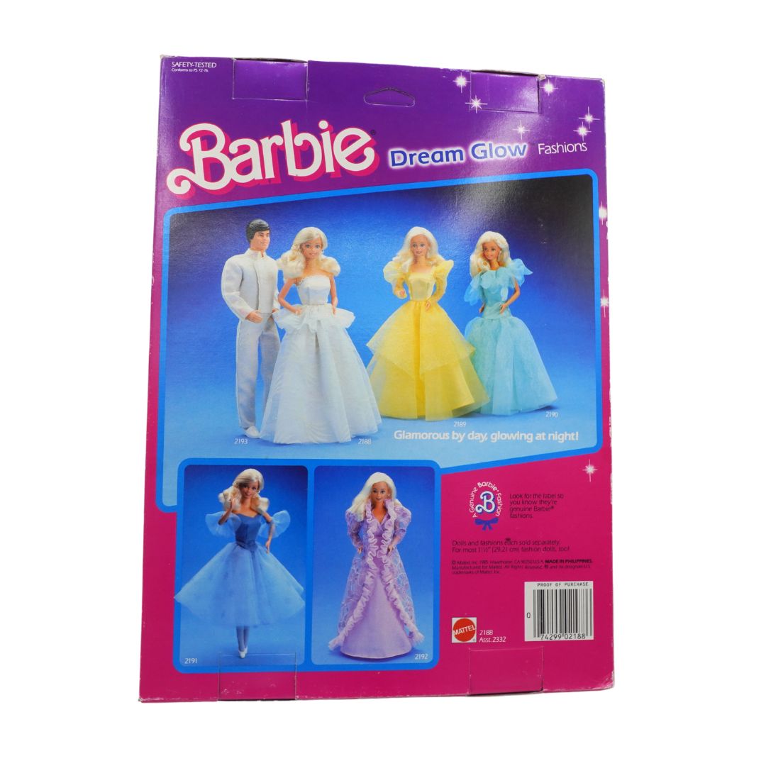 Barbie Dream Glow fashion dolls packaging with four dolls in different outfits on a white background