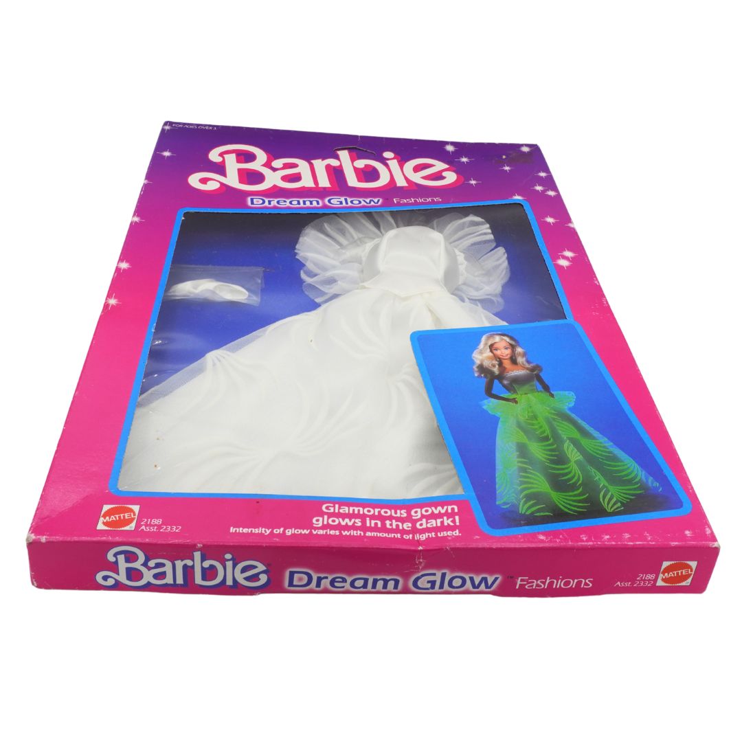 Barbie Dream Glow fashion doll packaging with a white gown and green dress.