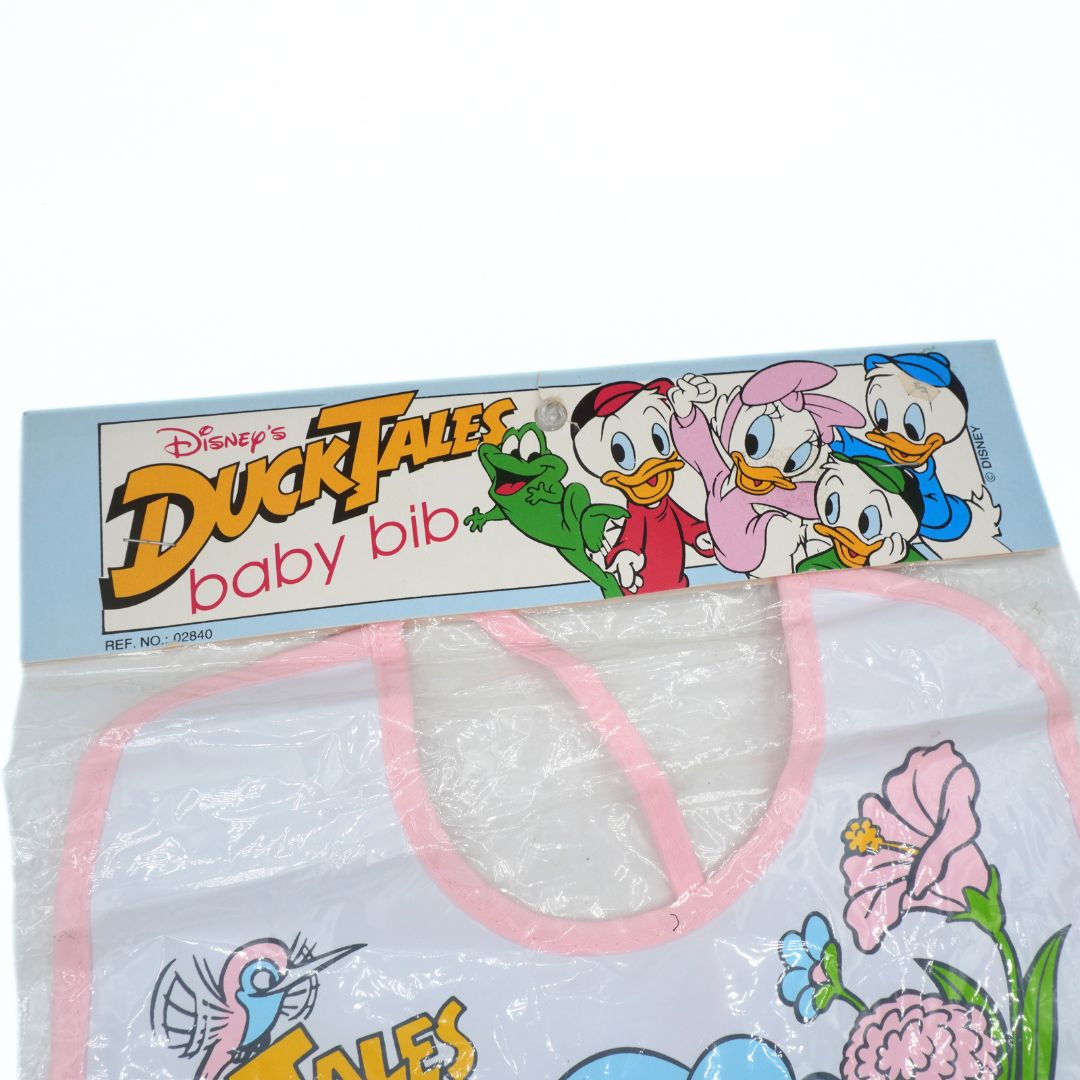 DuckTales baby bib packaging with cartoon characters on a white background