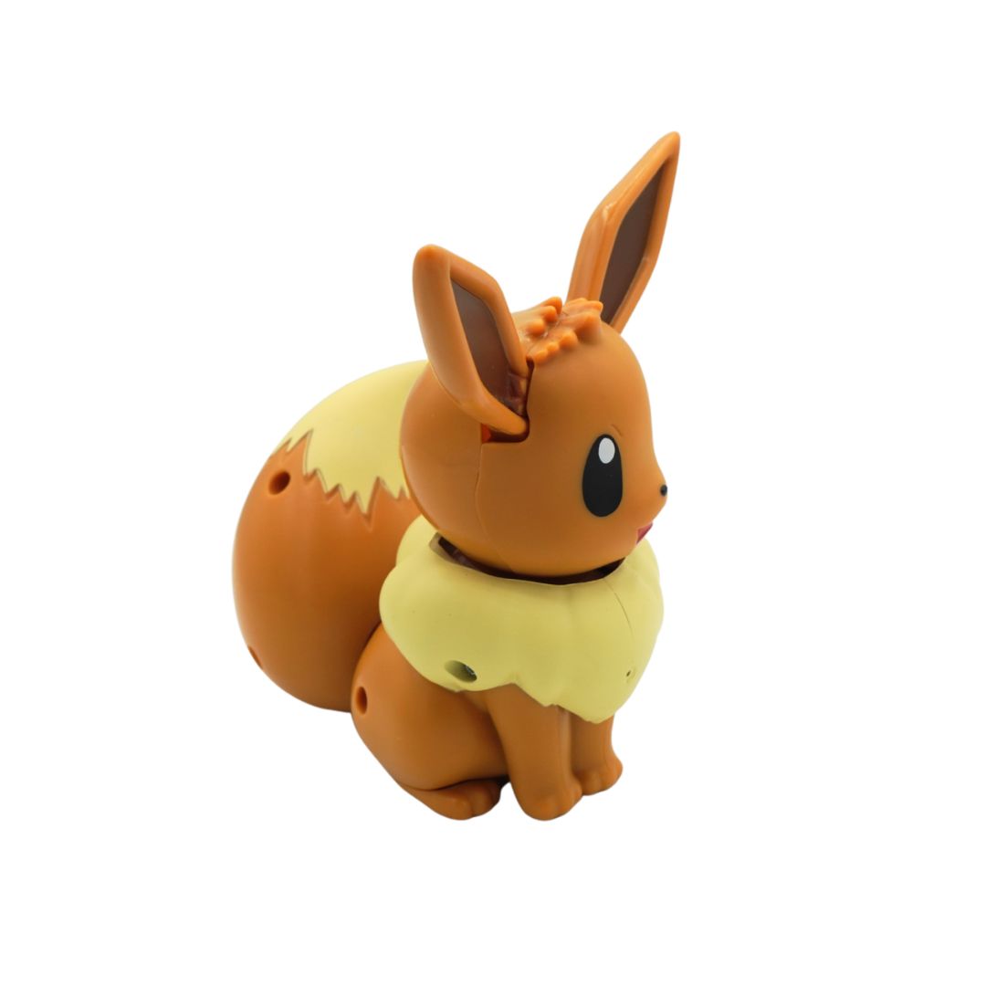 Side on picture of a brown Eevee electronic toy from the series Pokemon, on a white backdrop