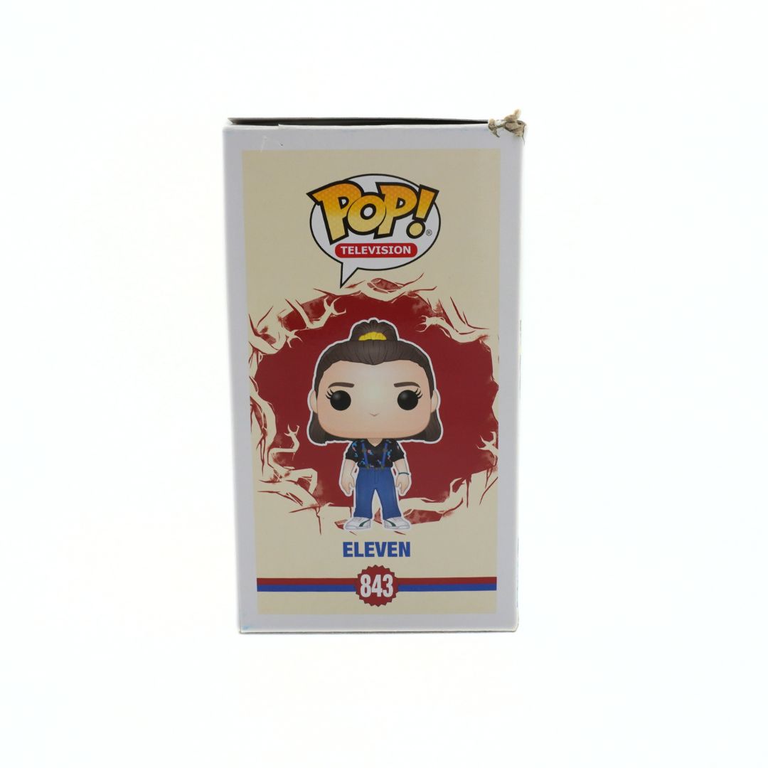Funko Pop! packaging featuring a character with a red background and 'Pop!' logo.
