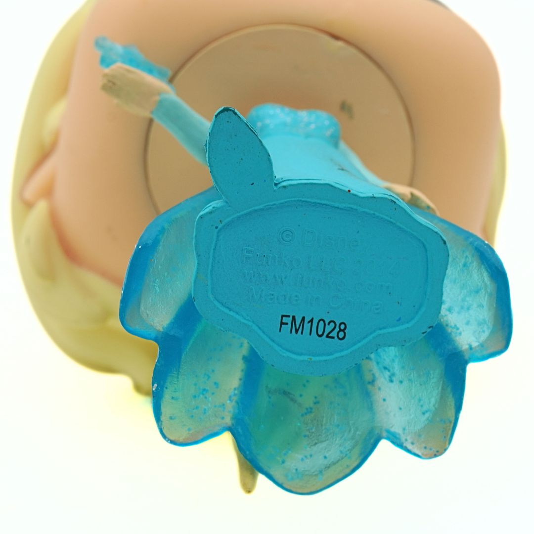 Blue plastic component with 'FM1028' marking on a white background