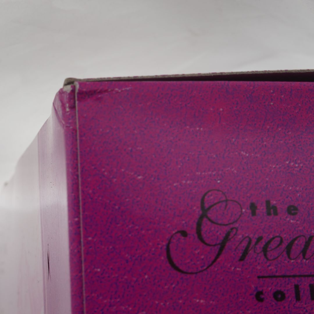 Close-up of a pink box with text on a white background