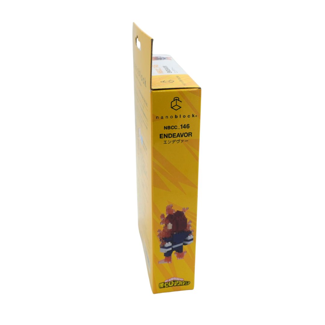 A yellow cardboard box for a nanoblock set, featuring the brand name 'nanoblock.' and product text 'NBCC.