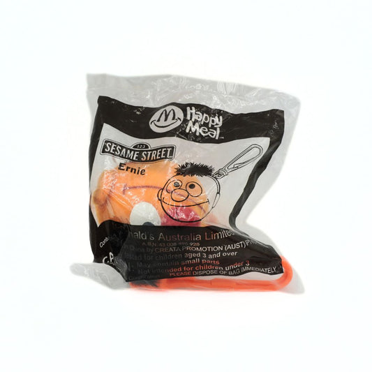 Happy Meal toy packaging featuring Ernie from Sesame Street on a white background