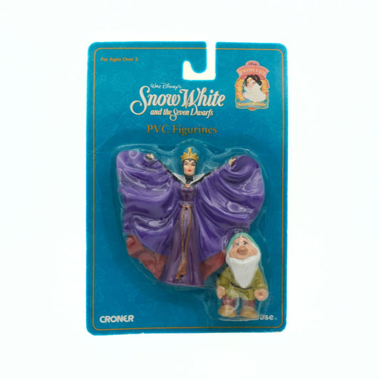 Packaged Snow White and Seven Dwarfs PVC figurines with blue background