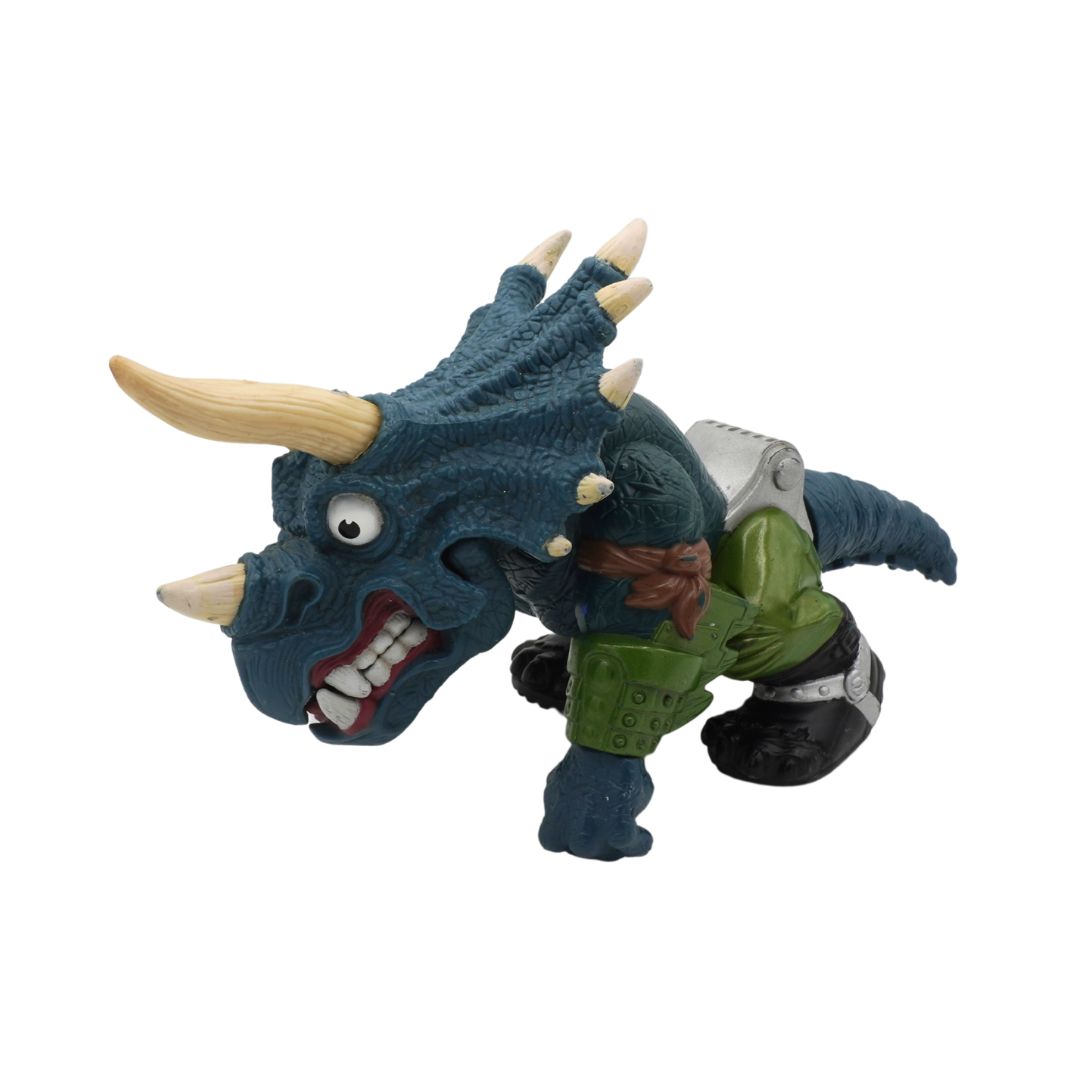 Toy figure of a dragon-like creature with green body and blue head on a white background