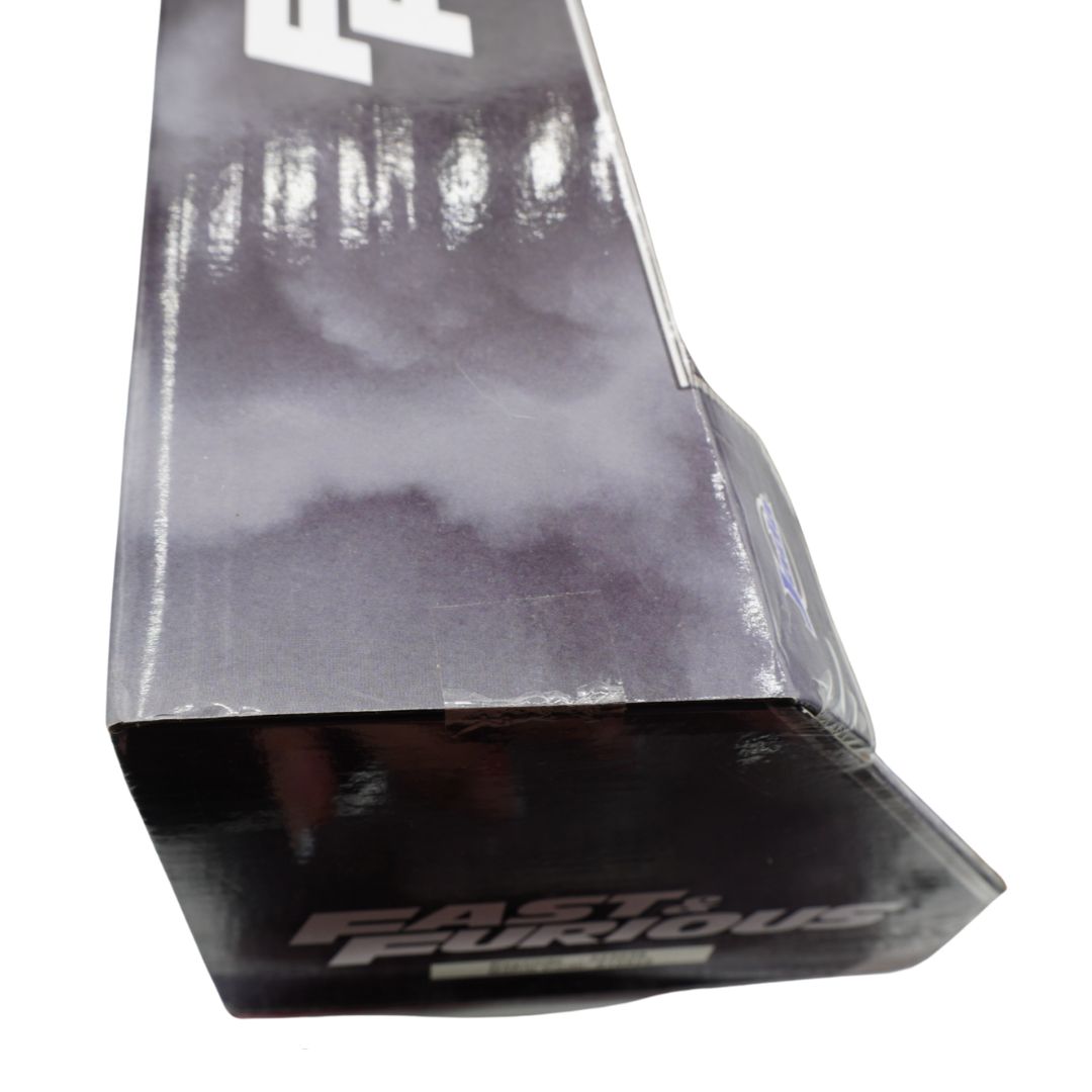 A close-up of a boxed toy, showing a black and gray box with the 'Fast & the Furious' logo on a white background.
