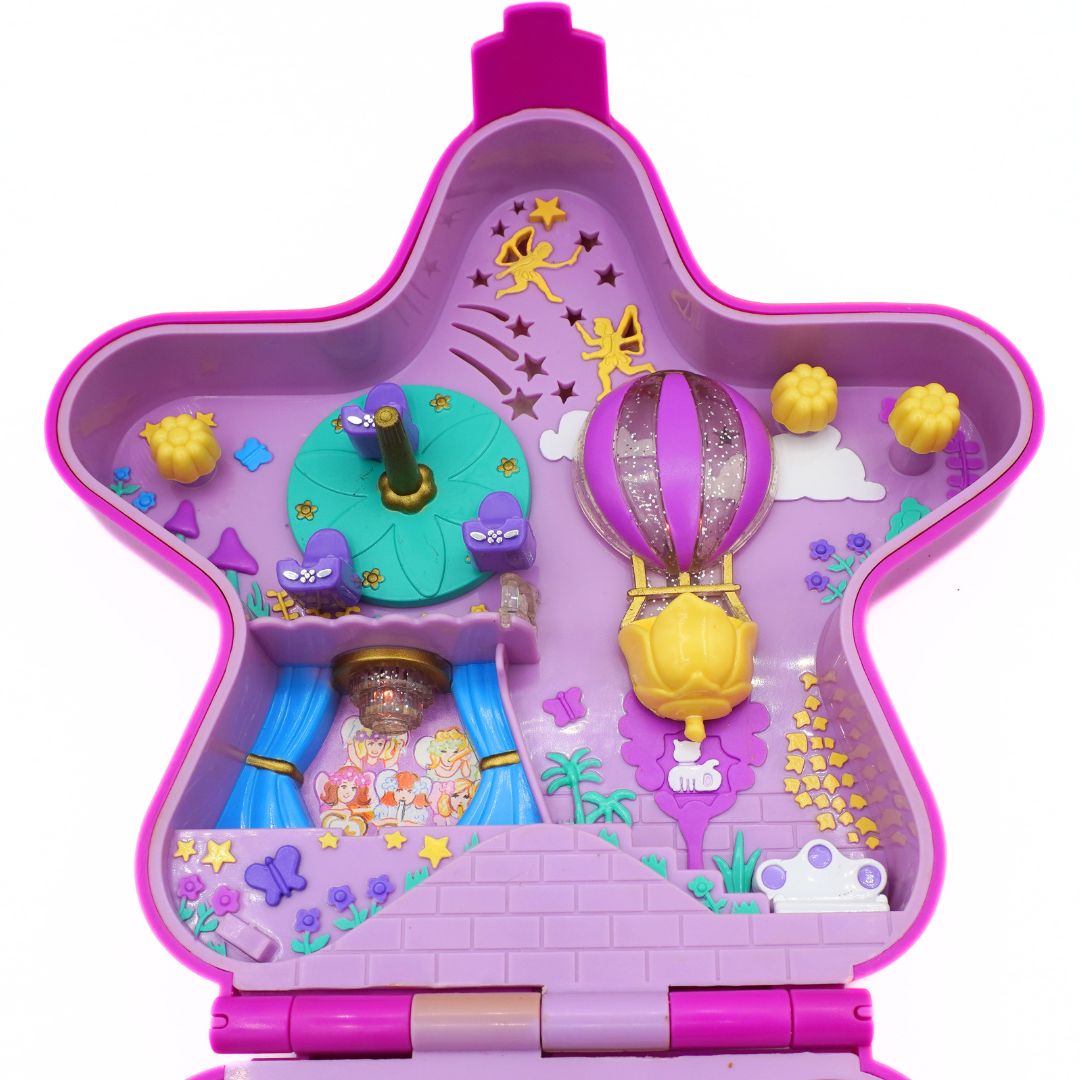 Toy set with a star-shaped base featuring various small toys and elements on a white background