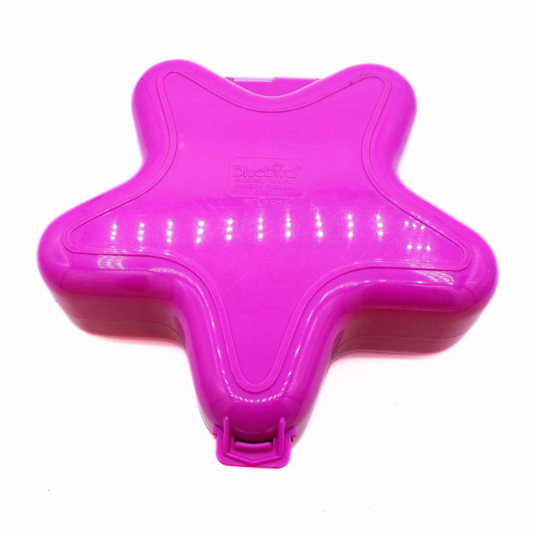Pink star-shaped object on a white background
