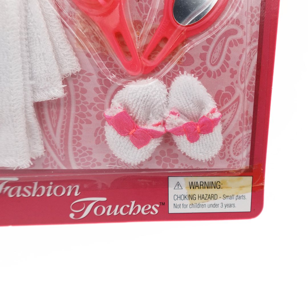 Photo of the bottom right of a fashion touches accessory kit with yellowed tape