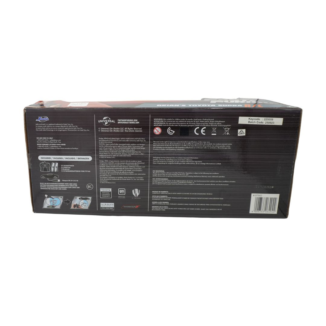 The back of a black product box with technical specifications, safety symbols, and a barcode, photographed against a plain white background.