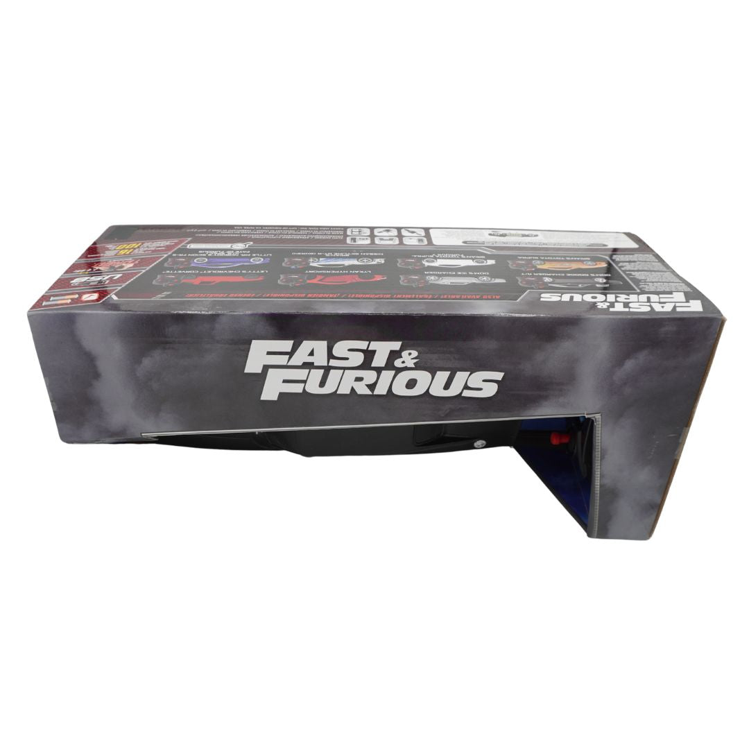A boxed Fast & Furious collectible or model set photographed on a plain white background. The packaging is predominantly black and dark gray with large white 'FAST & FURIOUS' branding on the front.