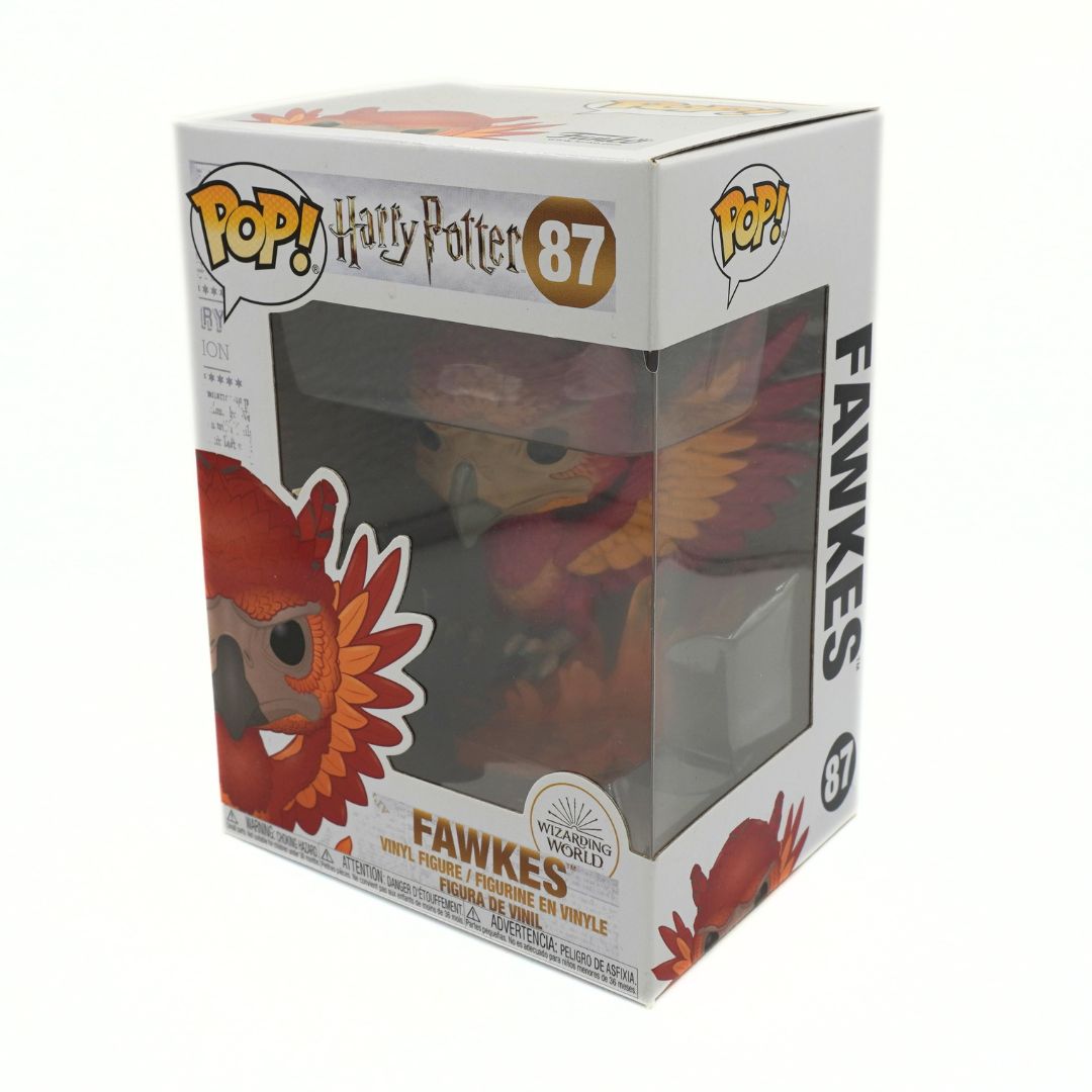 Funko Pop! vinyl figure of Fawkes, the owl from Harry Potter, shown in its original white window box packaging with character graphics and the number 87.