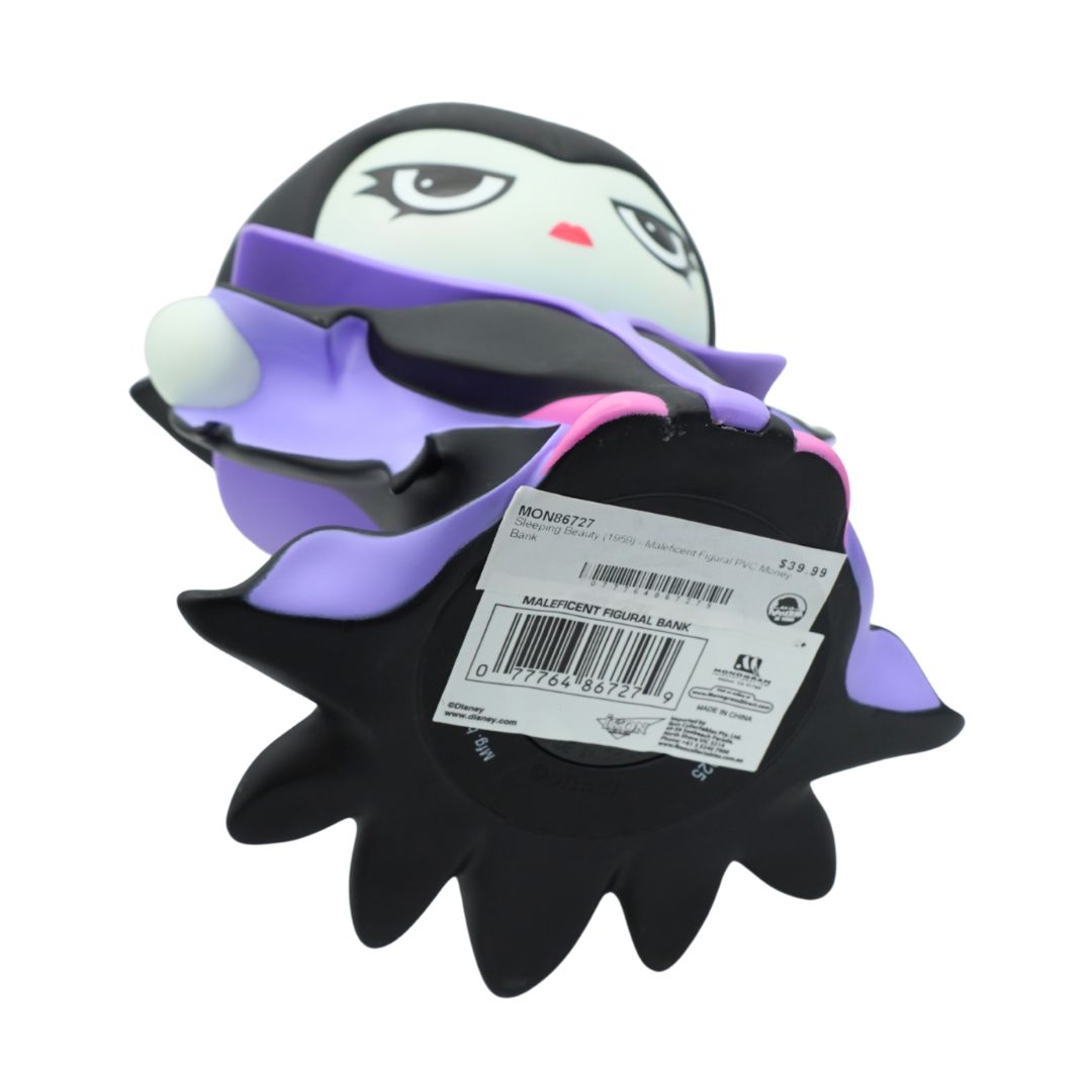 A green figurine wearing a purple and black jacket and black hat, holding a gold rod
