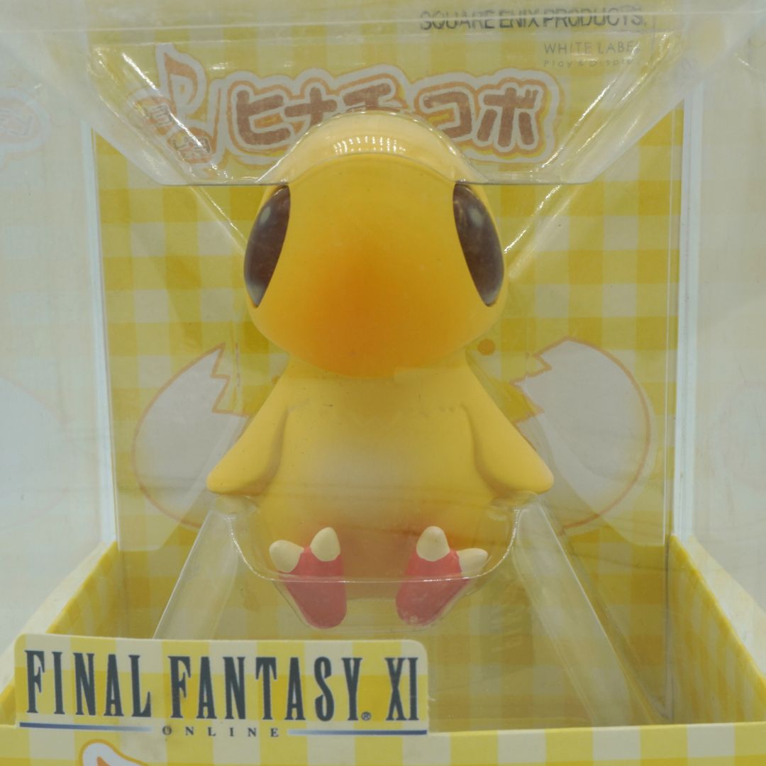 Yellow character figurine in packaging with 'Final Fantasy XI' branding