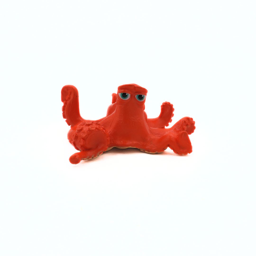 Red octopus toy on a white background