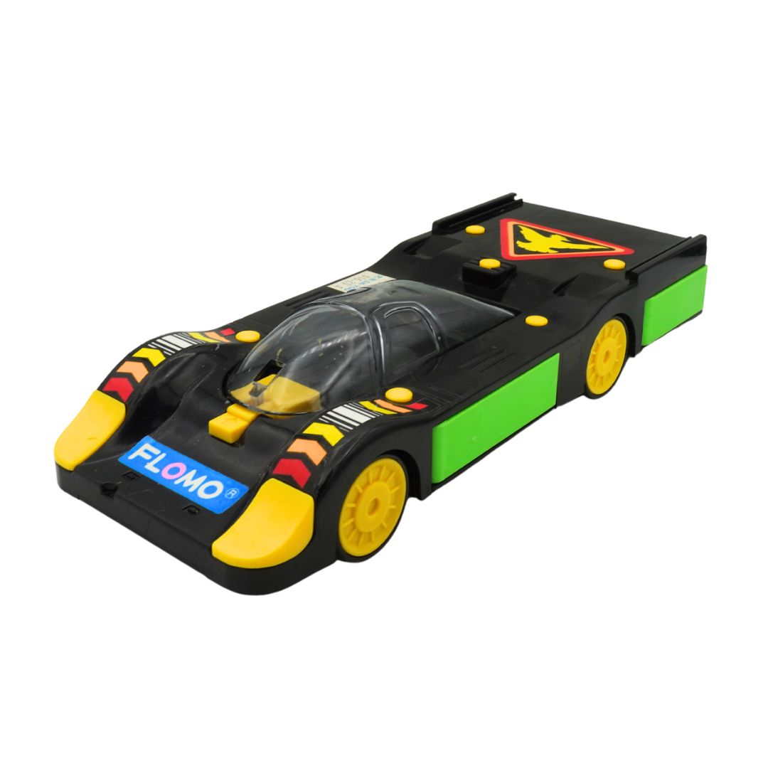 Toy race car with a black, green, and yellow design on a white background
