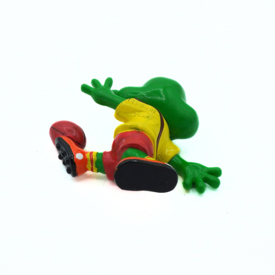 Colorful frog figurine on a white background